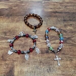 bundle of 3 stretchy beaded bracelets with charms
